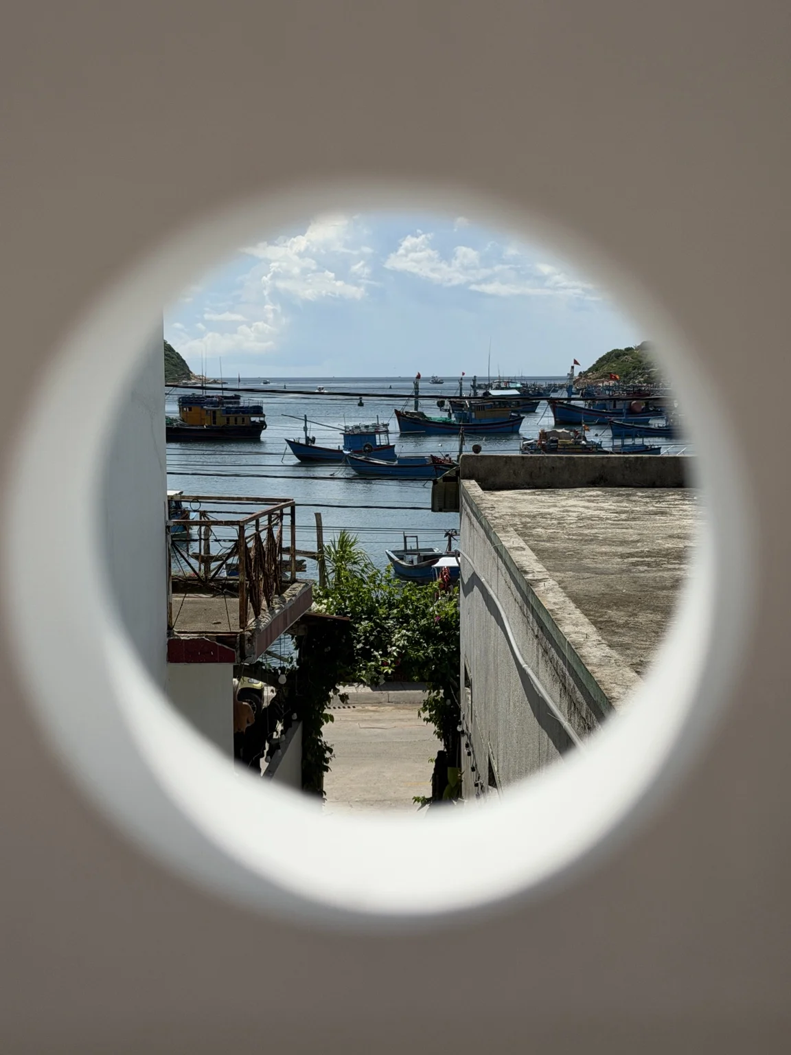Round window framing the bay